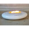Candlewide Alabaster White ceramic candle burning with a wide, calm flame in use